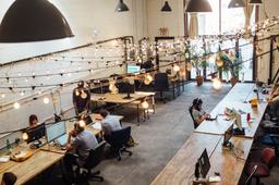 Image of a startup office with people working